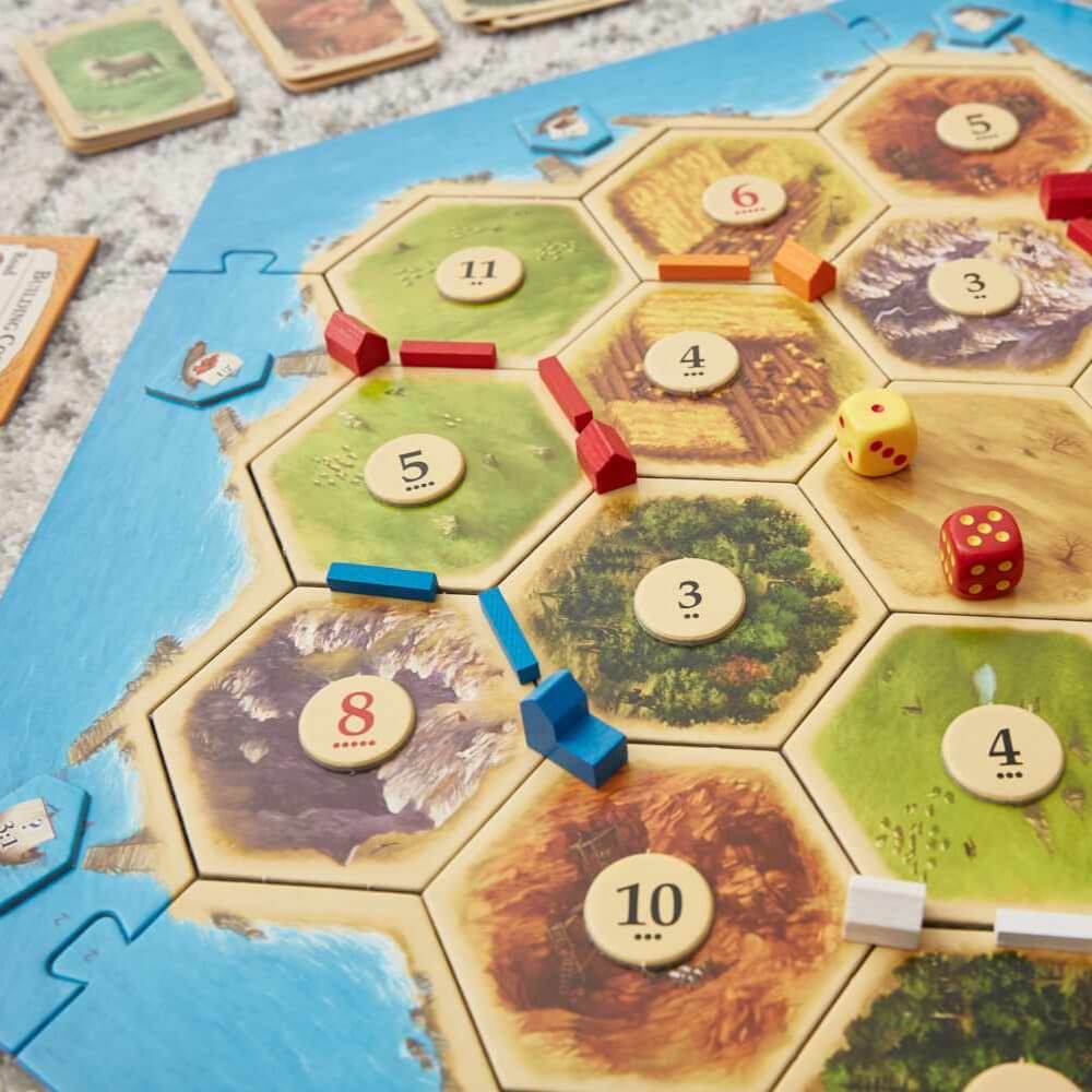 A game of settlers is shown on a table.